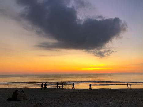people enjoy the scenic sunset at List at sland Sylt in Germany