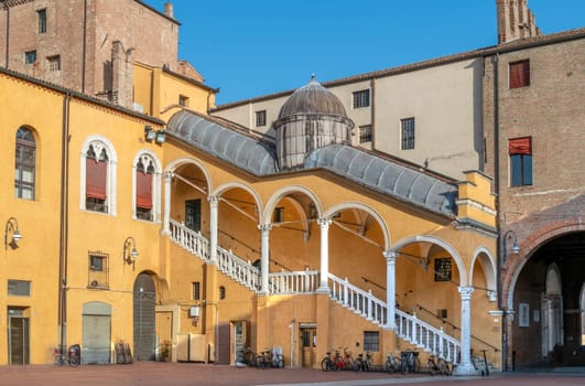 Town Hall Square in Ferrara, Italy, with the historic staircase scalone d onore (1481) characterized by a vaulted roof with a central dome and arches in the Renaissance style