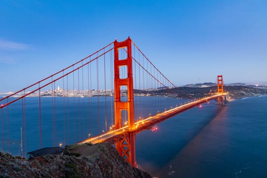 golden gate bridge in San Francisco in dawn with lights