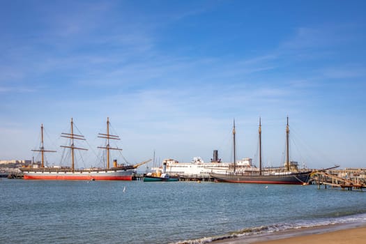 view to Hyde park pier in San Francisco with historic ships like sailors and ferries, USA