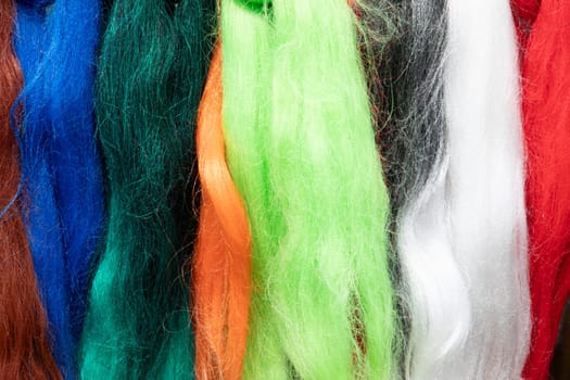 detail of colored wool in rainbow color gives a harmonic background