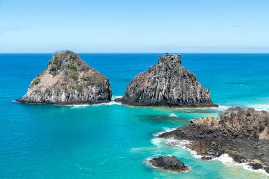 Fernando de Noronha, Brazil. View of Morro dos Dois Irmaos with crystal clear turquoise ocean