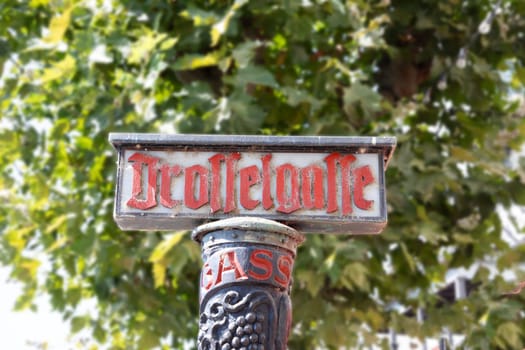 Drosselgasse lane and sign in Ruedesheim at the middle Rhine
