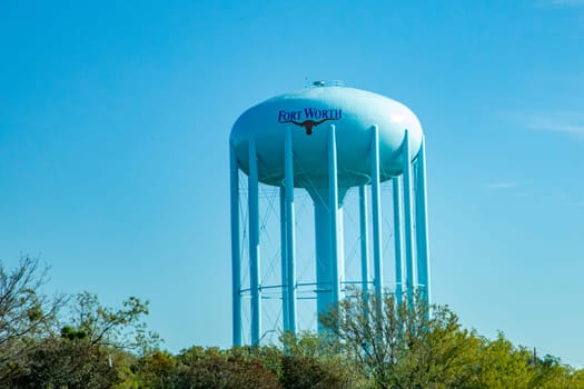 water tank and tower in Fort Worth with the typical longhorn under the name, Texas, USA
