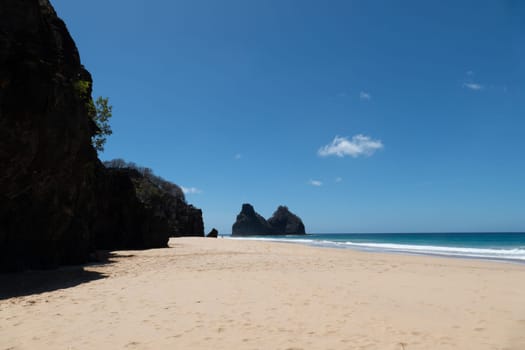 Fernando de Noronha, Brazil. View of Morro dos Dois Irmaos with crystal clear turquoise ocean
