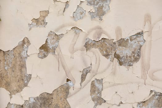 pattern of old wall with peeling white color as symbol for age