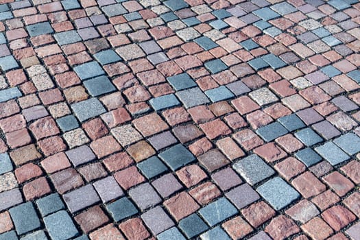 detail of colorful cobblestone pattern at the sidewalk