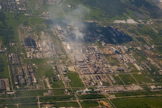 Top view of the industrial center of the city, factories and smoke pipes.