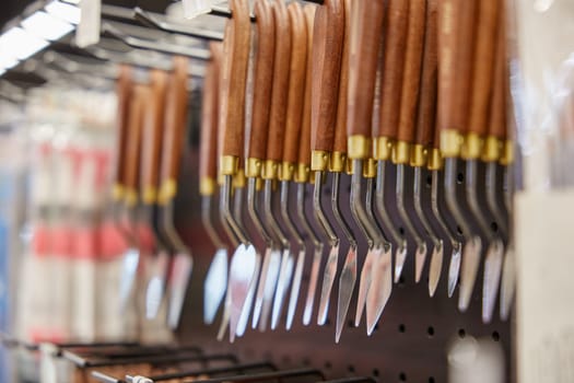 Selective focus with trowel or palette knife for drawing. Artistic tools showcase assortment at art stationery shop