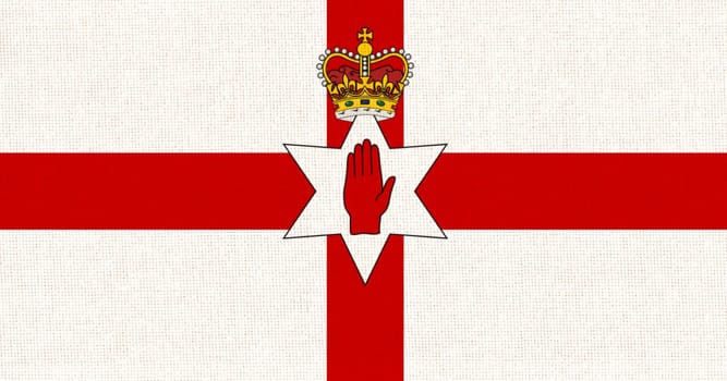 Flag of Northern Ireland. Irish flag on fabric surface. Northern Irish national flag on textured background. Republic of Northern Ireland. European country. State symbol of Northern Ireland