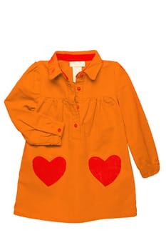 Summer dress isolated. A beautiful orange girls dress with attached heart shaped pockets and long sleeves isolated. Clipping path. Kids spring and autumn fashion.