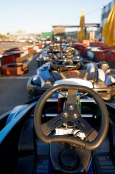 Kart car for carting without racer at open air training track. No people ring race and parking for racecar