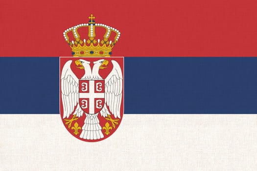 Flag of Serbia. Serbian flag on fabric texture. Fabric texture. National Serbian symbol. Serbian national flag. European country. National symbol of Serbia