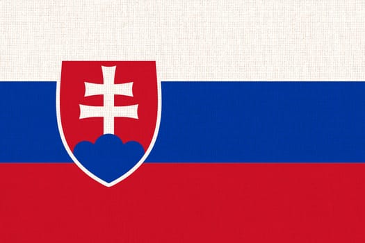 Flag of Slovakia. Slovak flag on fabric texture. National Slovak symbol. Slovak national flag. Slovak Republic. European country. National symbol of Slovakia