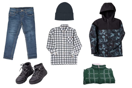 Collage set of little boys autumn clothes isolated. Denim trousers and jacket, sneaker, a down jacket, pants and hood for child boy. Children's winter fashion.