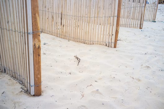 Sand barriers placed to protect coastal ecosystems. Low angle view