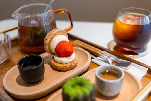Strawberry dessert with coffee and tea in cafe