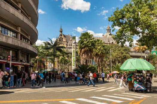 Medellin, Colombia - December 9, 2023: Street view capturing the essence of daily life in Medellin with ordinary people going about their routines. Antioquia department, Colombia.