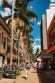 Medellin, Colombia - December 9, 2023: Street view capturing the essence of daily life in Medellin with ordinary people going about their routines. Antioquia department, Colombia.