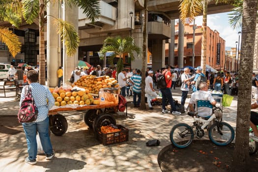 Medellin, Colombia - December 9, 2023: Street view capturing the essence of daily life in Medellin with ordinary people going about their routines. Antioquia department, Colombia.