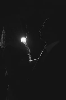 Black outline groom and bride on the ceremony of removing the veil
