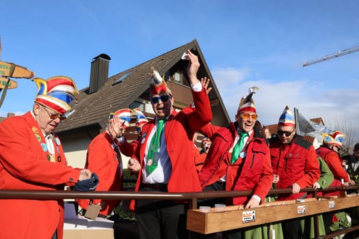 Theme picture - Carnival Carnival  The fools are on the loose at the Alemannic-Swabian Carnival. As here in Hartheim am Rhein,the jesters parade through the streets,here the parade float of the Hartheim Rhine spirits with the Narrenrat/Elferrat