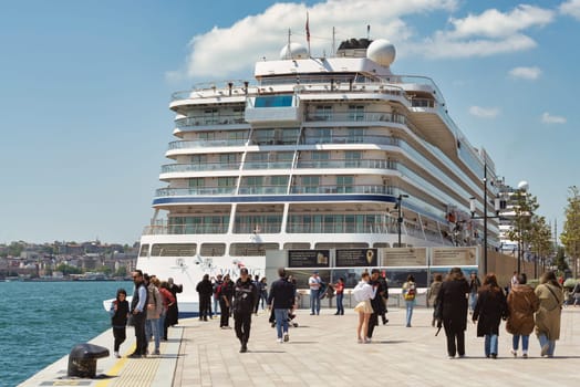 Istanbul, Turkey - May 13, 2023: Viking Sky, luxury cruise ship docked at terminal of Galataport, a mixed use development located along shore of Bosphorus