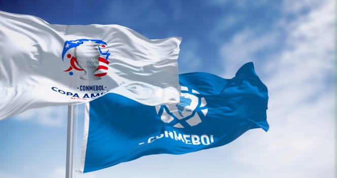 Miami, US, Dec. 3 2023: Copa America USA 2024 Flag waving with CONMEBOL flag. Illustrative editorial 3d illustration render. Selective focus