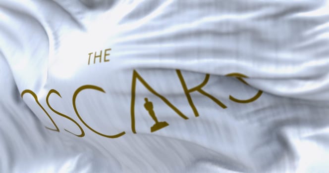 Los Angeles, US, Feb. 12 2023: Close-up of The Oscars white flag waving. The Academy Awards are the most prestigious award in the film industry. Illustrative editorial 3d illustration render