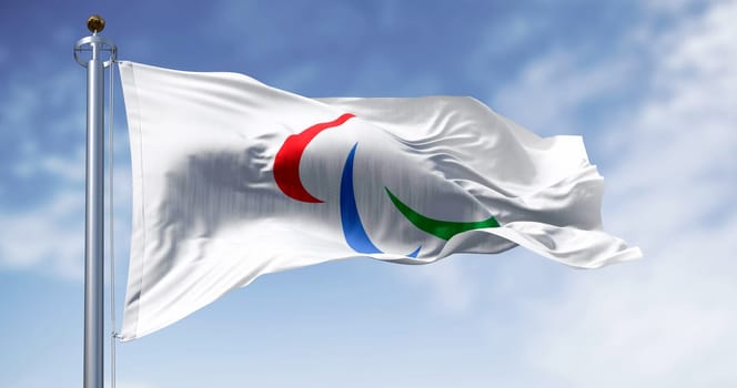 Bonn, DE, Feb. 14 2024  Paralympic flag waving in the wind on a clear day. The Paralympics celebrate elite sport for athletes with disabilities globally. Illustrative editorial 3d illustration render