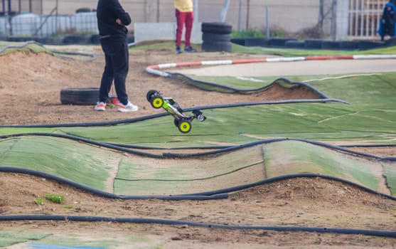 Merida, Spain - Jan 28th, 2024: Extremadura 1/8tt gas Championship RC Car. Cars jumping in an area of undulations