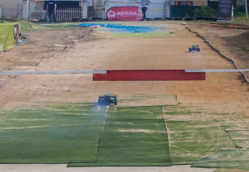 Merida, Spain - Jan 28th, 2024: Extremadura 1/8tt gas Championship RC Car. Cars crossing the finish line