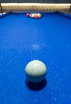 Full rack ready for the break shot. Eight-ball pool game at six pocket blue table.