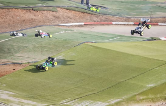 Merida, Spain - Jan 28th, 2024: Extremadura 1/8tt gas Championship RC Car. Cars jumping