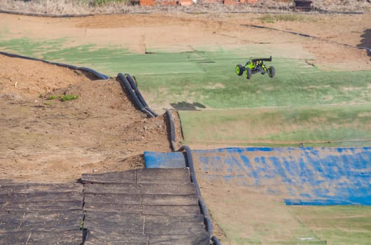Merida, Spain - Jan 28th, 2024: Extremadura 1/8tt gas Championship RC Car. Cars jumping in an area of undulations