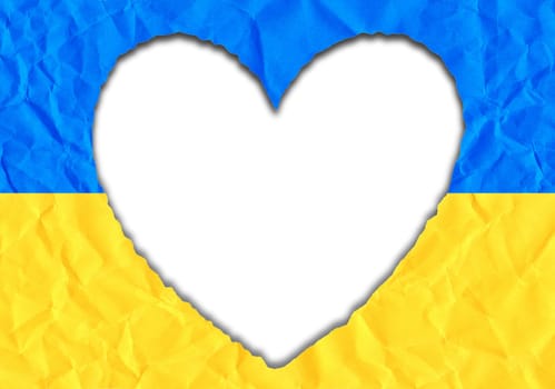 Scrap of paper in the shape of a heart in the colors of the Ukrainian flag, copy space