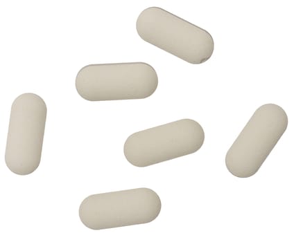 White oval tablet on isolated background, close up. Top view