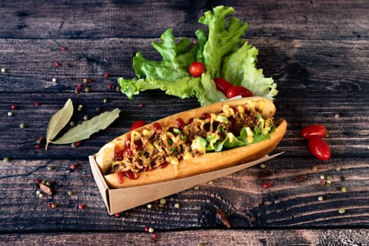 Tasty and warmy Hot dog  on a wooden background