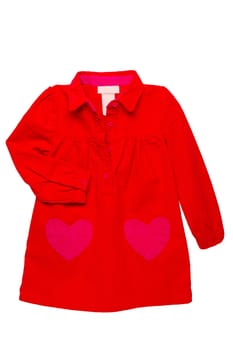 Summer dress isolated. A beautiful red girls dress with attached heart shaped pockets and long sleeves isolated. Clipping path. Kids spring and autumn fashion.