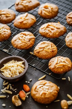 Homemade peanut butter cookies with almond on dark background