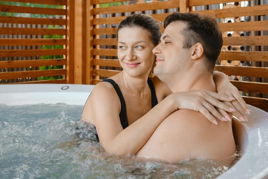 A happy married couple relaxes at the spa on a joint vacation