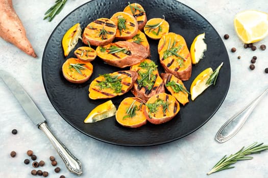 Grilled sweet potato, batata with olive oil and herbs.