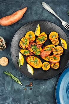 Grilled sweet potato, batata with olive oil and herbs.