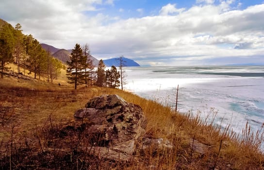 Spring on Baikal, ice and snow on the lake melt. The beauty of the nature of Baikal in the early spring.