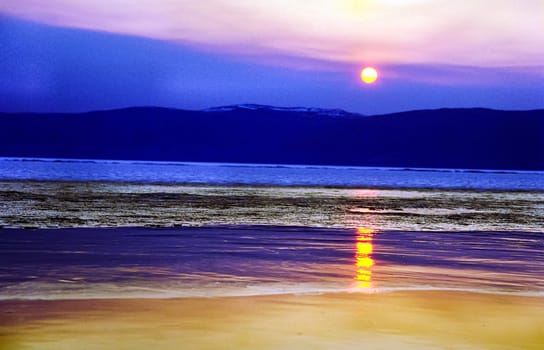 Winter on the Baikal, ice and snow on the lake. The beauty of the nature of Baikal in winter.