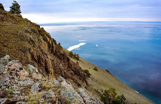 Spring on Baikal, ice and snow on the lake melt. The beauty of the nature of Baikal in the early spring.