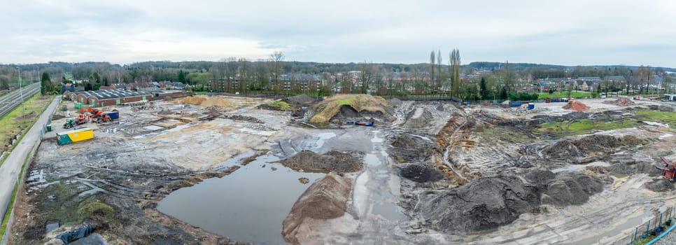 aerial view of a construction site next to a reesidential area
