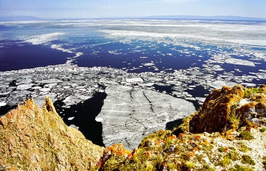 Winter on the Baikal, ice and snow on the lake. The beauty of the nature of Baikal in winter.