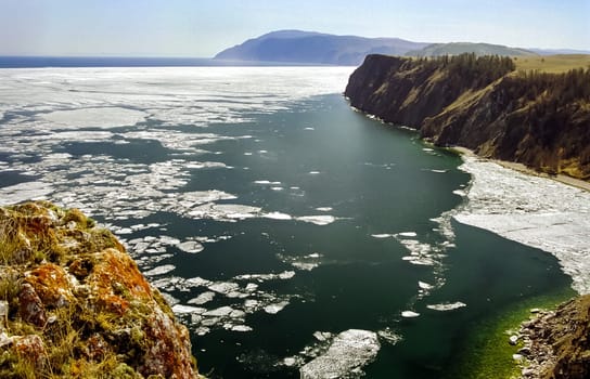 Winter on the Baikal, ice and snow on the lake. The beauty of the nature of Baikal in winter.