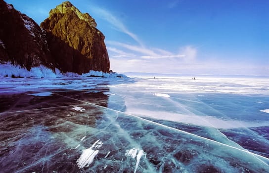 Winter on the Baikal, ice and snow on the lake. The beauty of the nature of Baikal in winter.